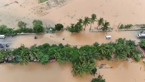 Aerial view of floodwater covering streets in a coastal community in Zambales, Philippines