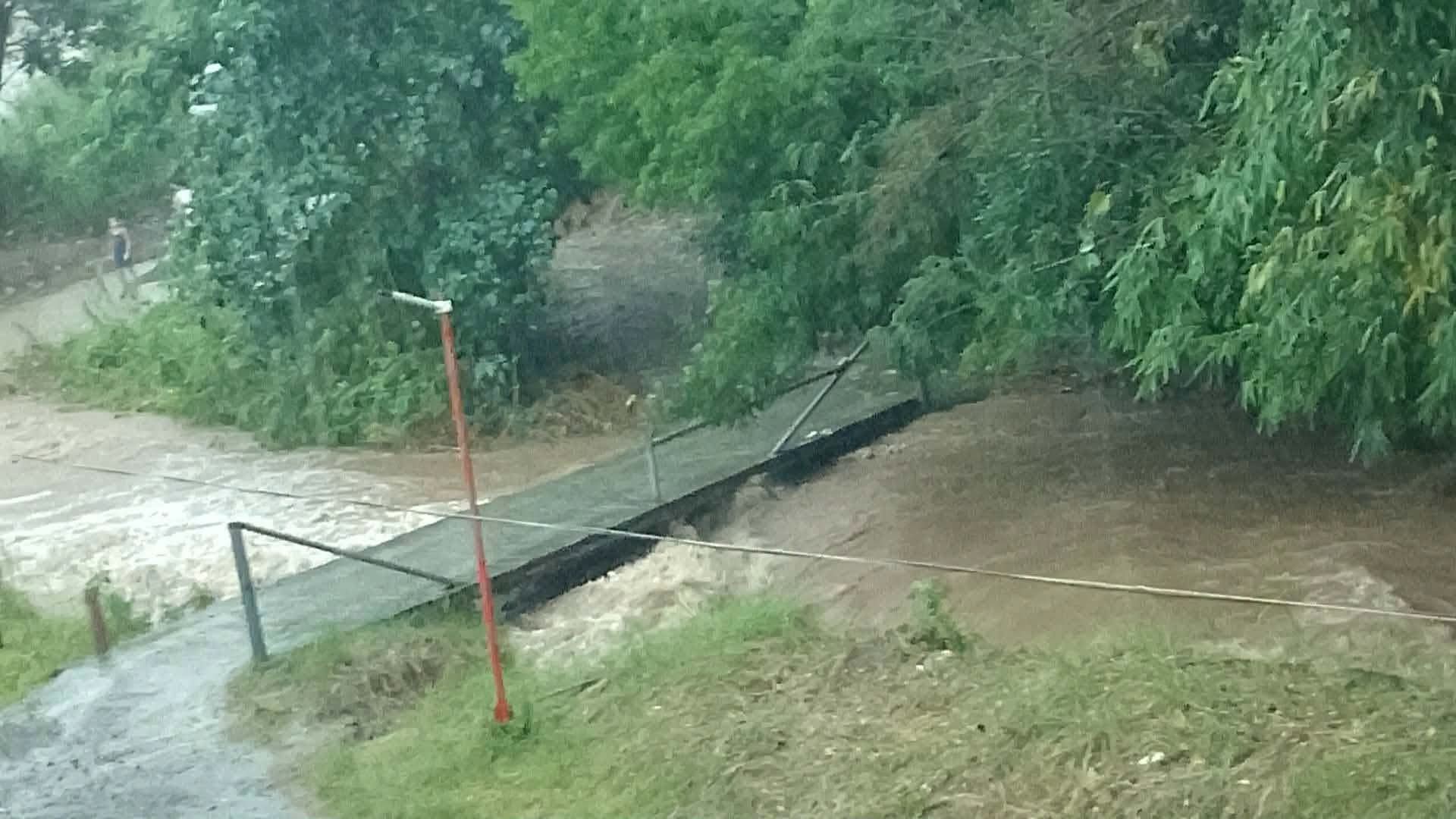 Bridge and community access affected by Typhoon Obet flooding in the Philippines